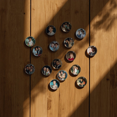 Circular photo prints of people arranged in a heart shape on a wooden surface.