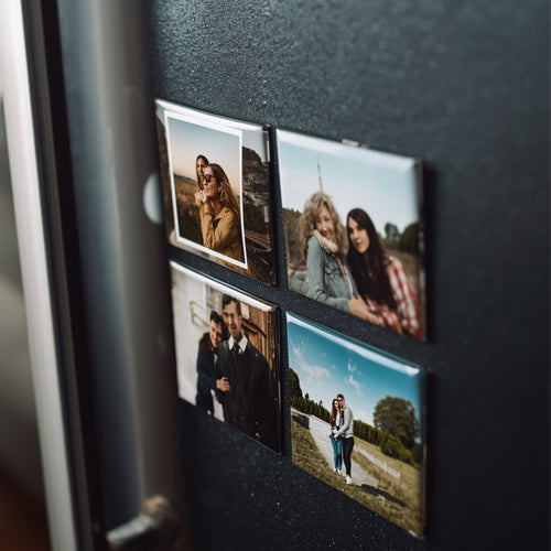 Fridge with photo magnets showing people in various poses